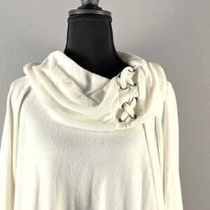 Sweater with shoelace type design